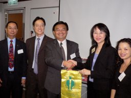 Chairman Fred Kwan presenting a survenir to Cecili